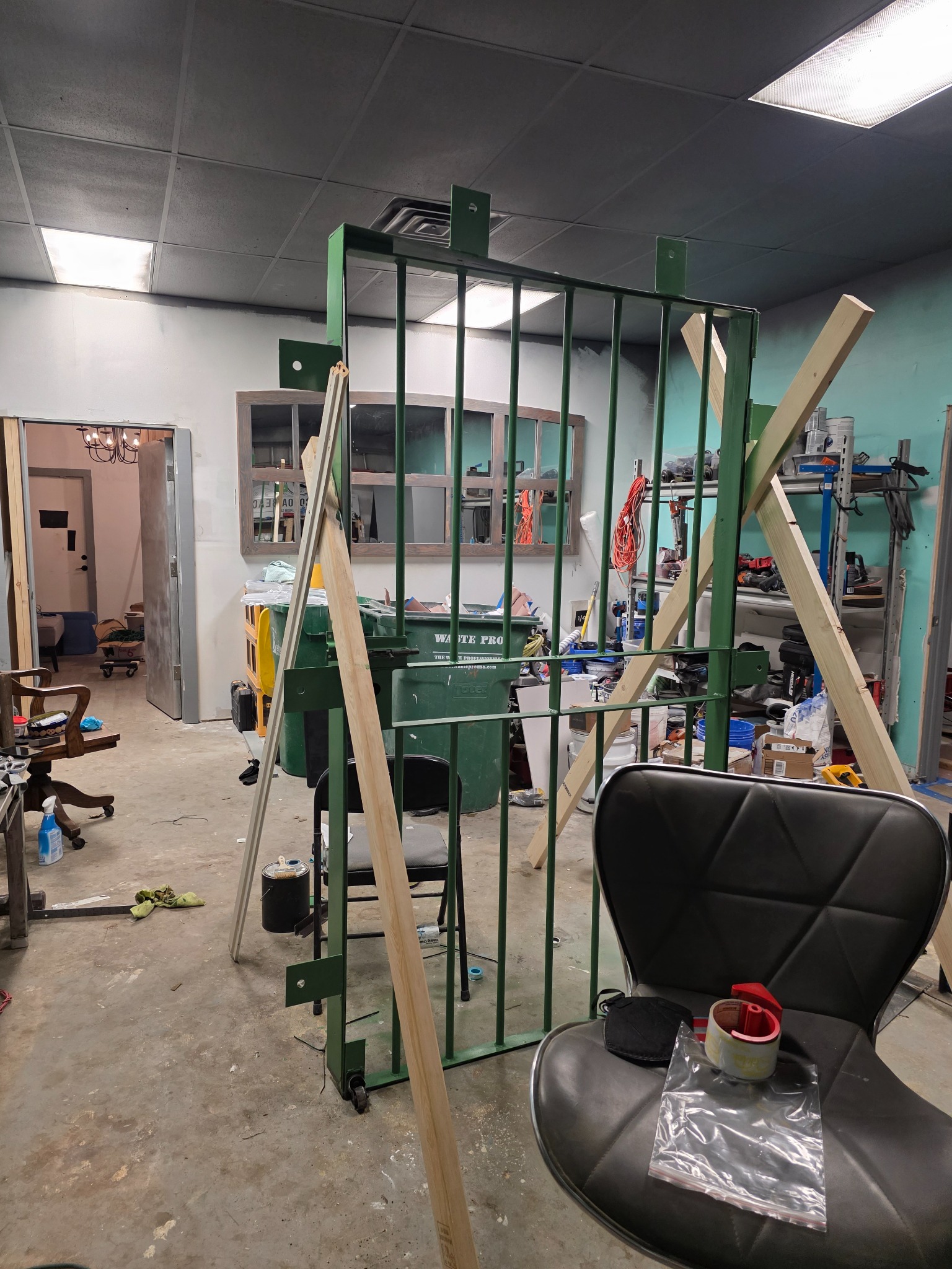 Construction view of the future Bangkok escape room with custom jail bars being built at Escape Cocoa Beach.