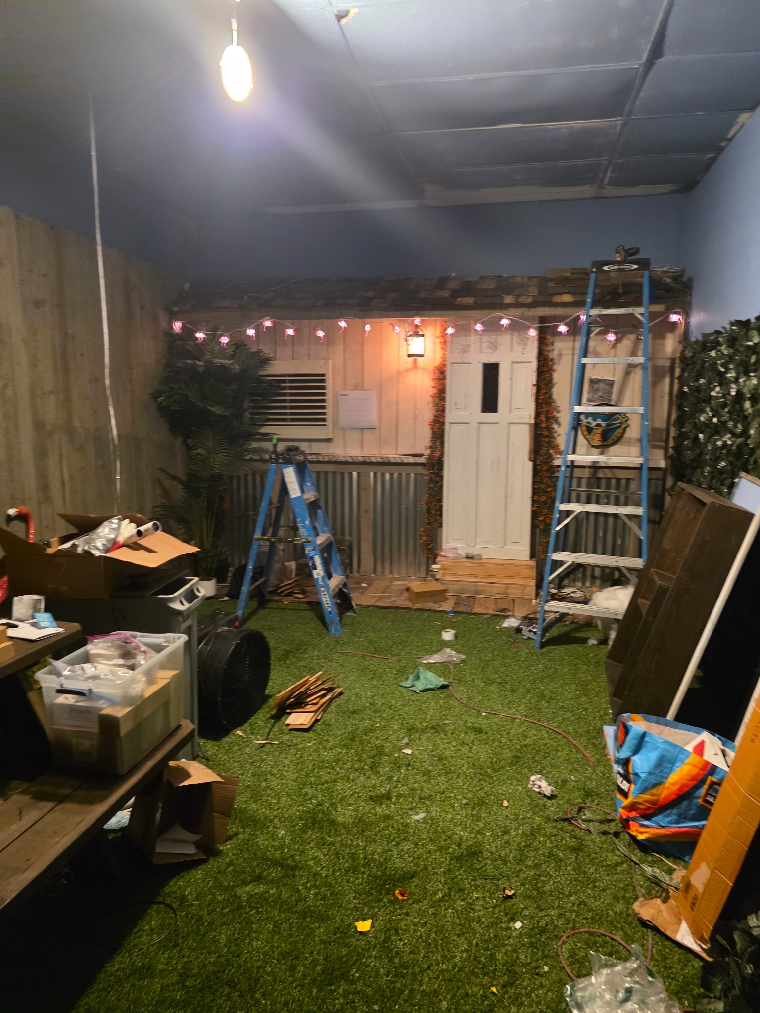 Florida Man’s Wild Adventure escape room under construction with the backyard shack set being built at Escape Cocoa Beach.