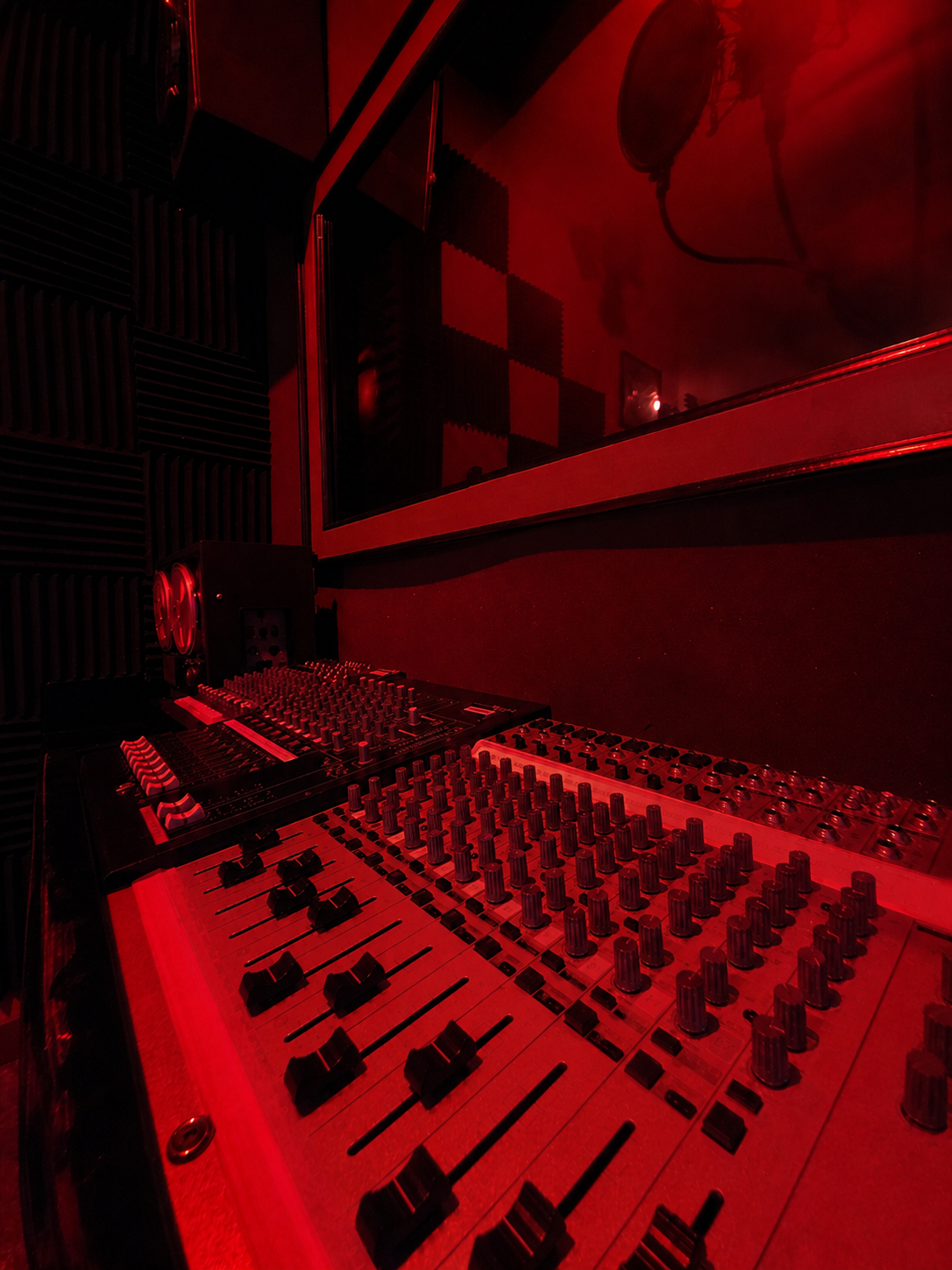 Close-up of the mixing console and recording studio equipment inside Mogul’s Secret Scandal at Escape Cocoa Beach.